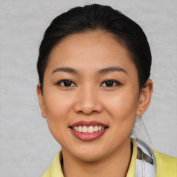 Joyful asian young-adult female with short  brown hair and brown eyes