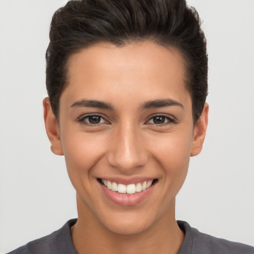 Joyful white young-adult female with short  brown hair and brown eyes