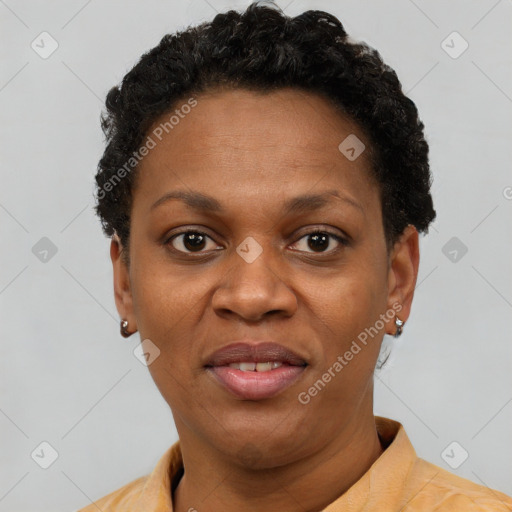 Joyful black adult female with short  brown hair and brown eyes