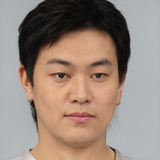 Neutral asian young-adult male with short  brown hair and brown eyes