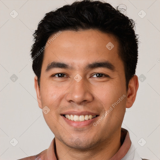 Joyful white young-adult male with short  black hair and brown eyes