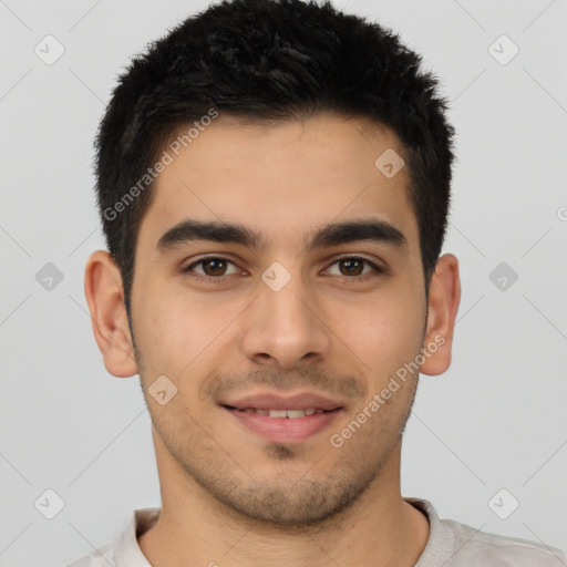 Joyful latino young-adult male with short  brown hair and brown eyes