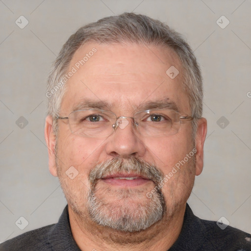 Neutral white middle-aged male with short  gray hair and brown eyes