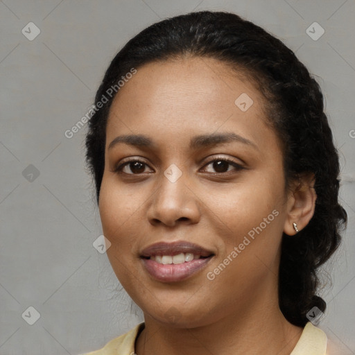 Joyful black young-adult female with medium  black hair and brown eyes