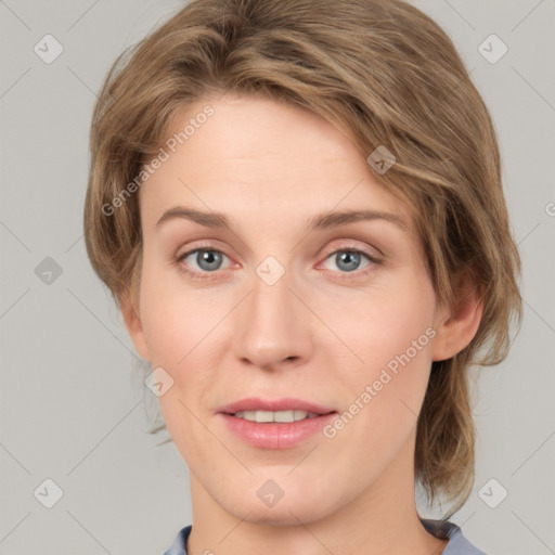 Joyful white young-adult female with medium  brown hair and green eyes