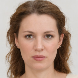 Joyful white young-adult female with medium  brown hair and green eyes