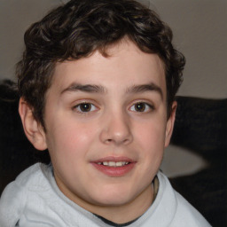 Joyful white child male with short  brown hair and brown eyes