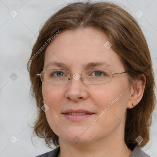 Joyful white adult female with medium  brown hair and blue eyes