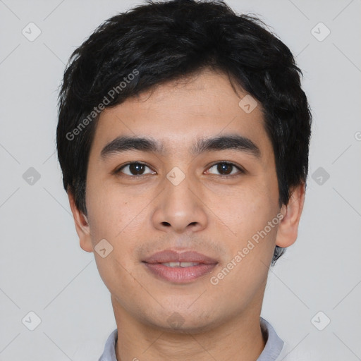 Joyful asian young-adult male with short  black hair and brown eyes