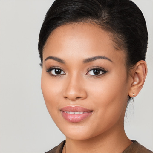 Joyful latino young-adult female with long  brown hair and brown eyes