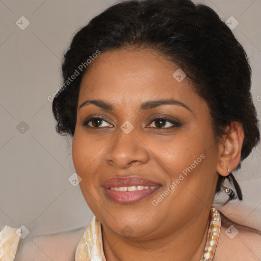 Joyful latino adult female with medium  brown hair and brown eyes