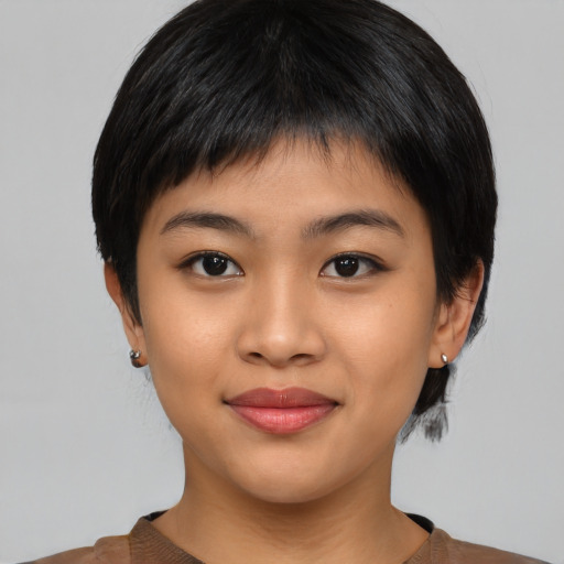 Joyful asian young-adult female with short  black hair and brown eyes