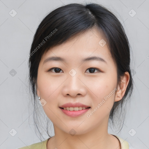 Joyful asian young-adult female with medium  black hair and brown eyes