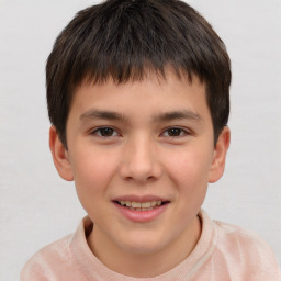 Joyful white child male with short  brown hair and brown eyes