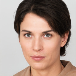 Neutral white young-adult female with short  brown hair and brown eyes