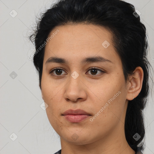 Joyful latino young-adult female with medium  brown hair and brown eyes