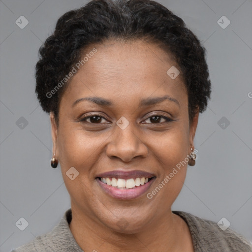 Joyful black adult female with short  brown hair and brown eyes