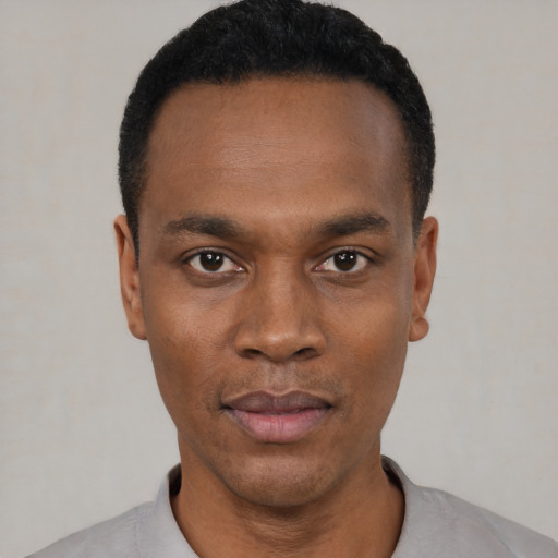 Neutral black young-adult male with short  black hair and brown eyes