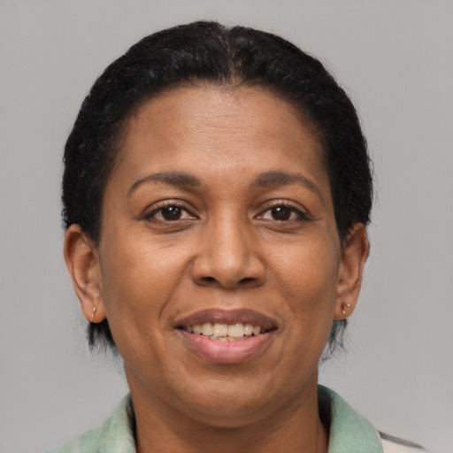 Joyful latino adult female with short  brown hair and brown eyes