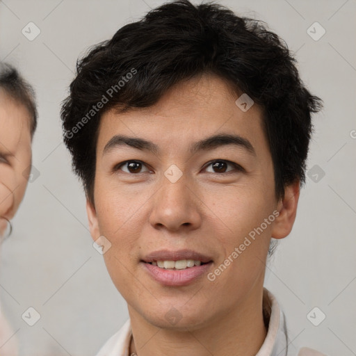 Joyful asian young-adult male with short  brown hair and brown eyes