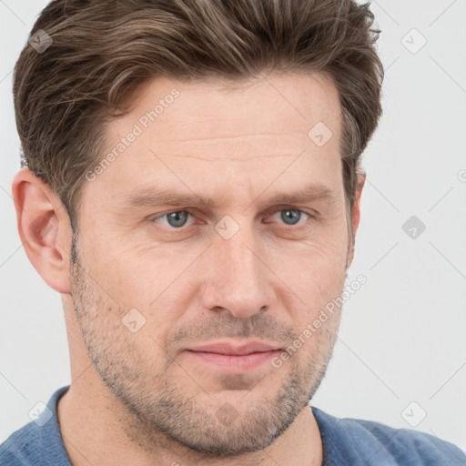 Joyful white adult male with short  brown hair and grey eyes