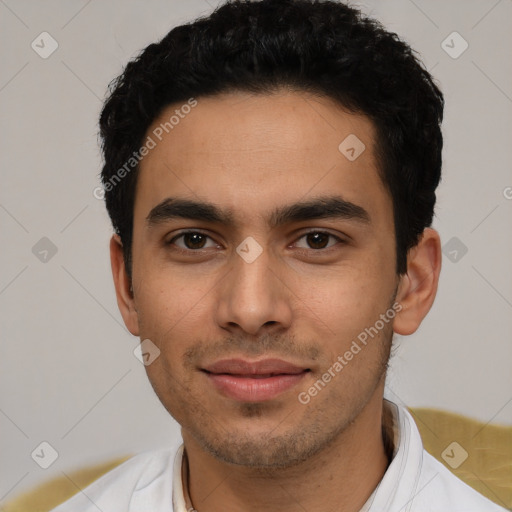 Joyful latino young-adult male with short  black hair and brown eyes