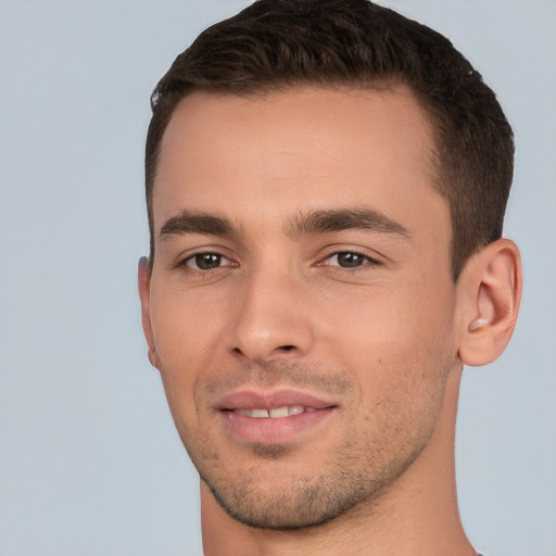 Joyful white young-adult male with short  brown hair and brown eyes