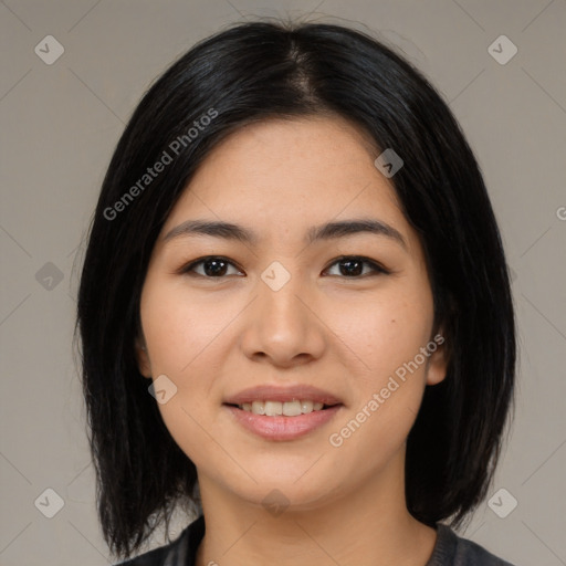 Joyful latino young-adult female with medium  black hair and brown eyes