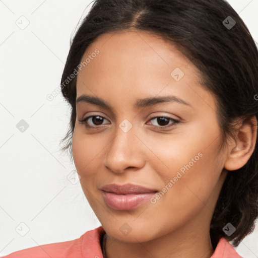 Joyful latino young-adult female with long  brown hair and brown eyes