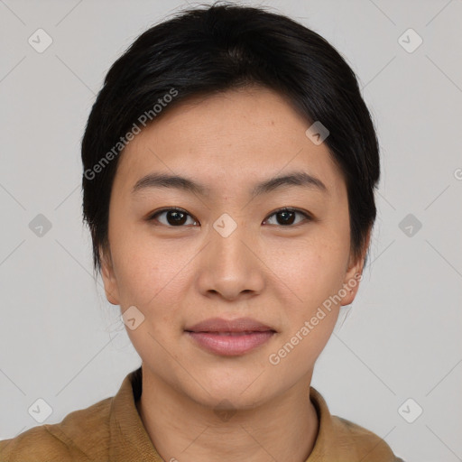 Joyful asian young-adult female with short  black hair and brown eyes