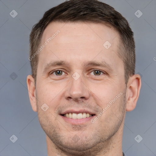 Joyful white adult male with short  brown hair and brown eyes