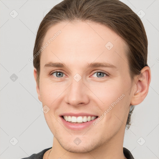 Joyful white young-adult female with short  brown hair and grey eyes