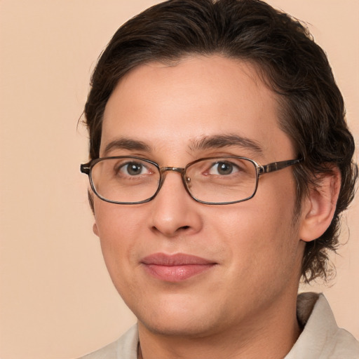 Joyful white young-adult male with medium  brown hair and brown eyes