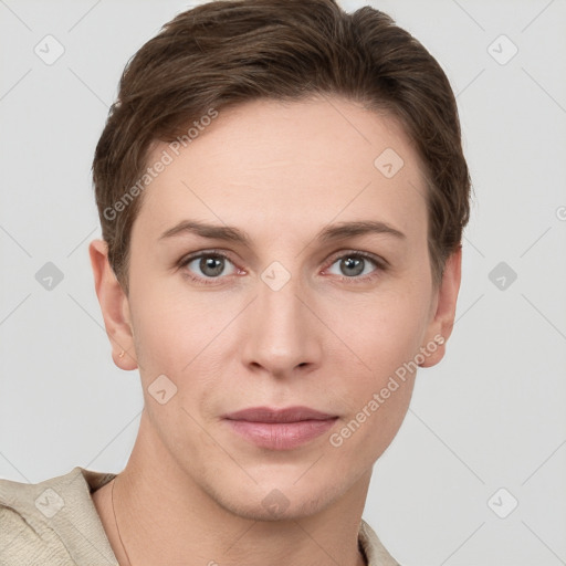 Joyful white young-adult female with short  brown hair and grey eyes