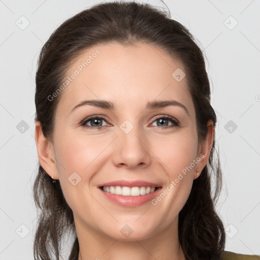 Joyful white young-adult female with medium  brown hair and grey eyes