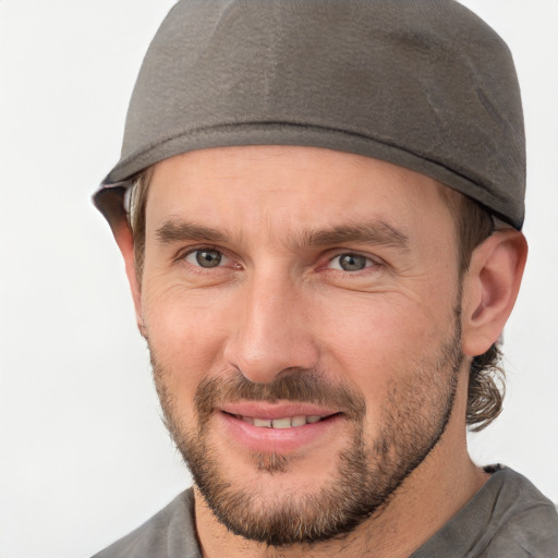 Joyful white adult male with short  brown hair and brown eyes