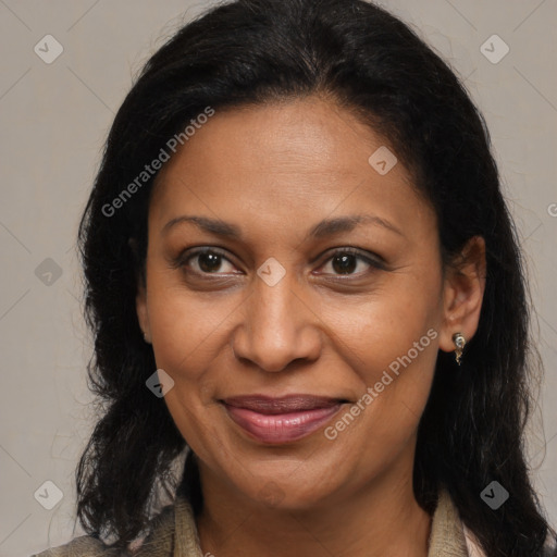 Joyful black adult female with medium  brown hair and brown eyes