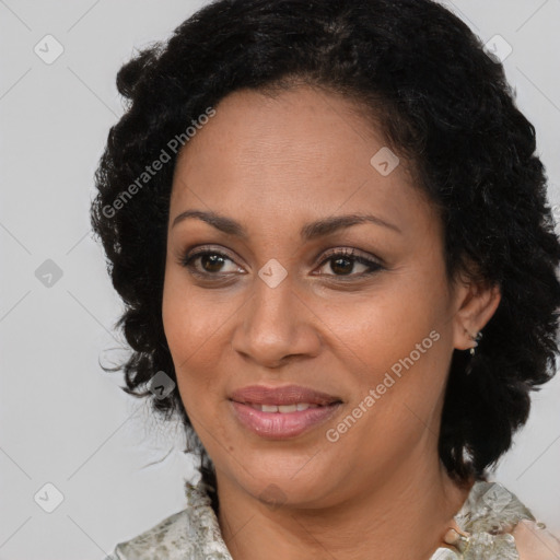 Joyful black adult female with medium  brown hair and brown eyes