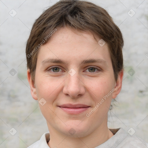 Joyful white young-adult female with short  brown hair and grey eyes