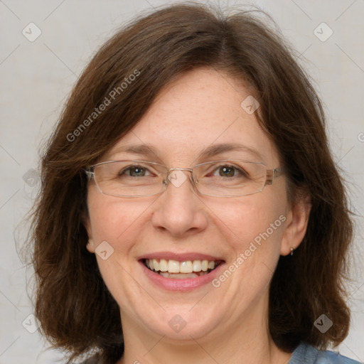 Joyful white adult female with medium  brown hair and blue eyes