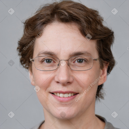 Joyful white adult female with short  brown hair and grey eyes