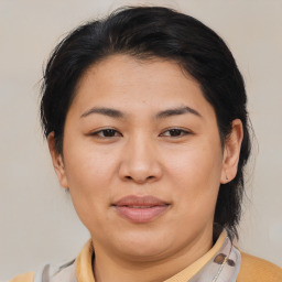 Joyful asian young-adult female with medium  brown hair and brown eyes