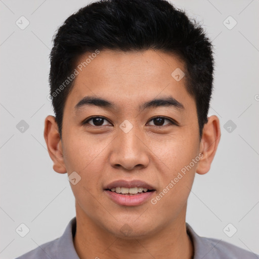 Joyful asian young-adult male with short  black hair and brown eyes