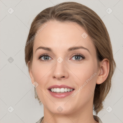 Joyful white young-adult female with medium  brown hair and grey eyes