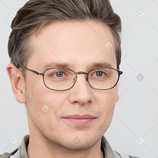 Joyful white adult male with short  brown hair and grey eyes