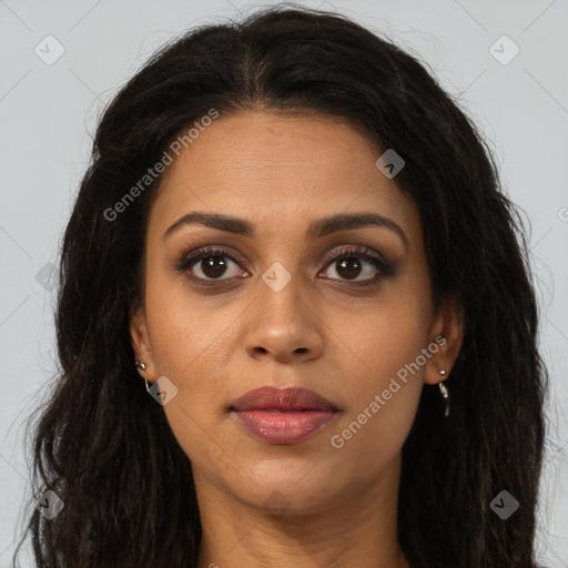 Joyful black young-adult female with long  brown hair and brown eyes