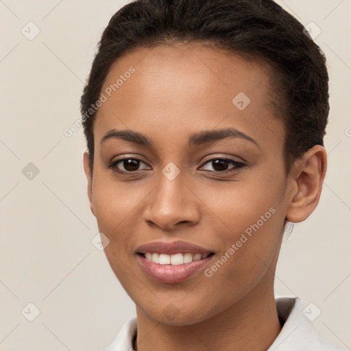 Joyful white young-adult female with short  brown hair and brown eyes