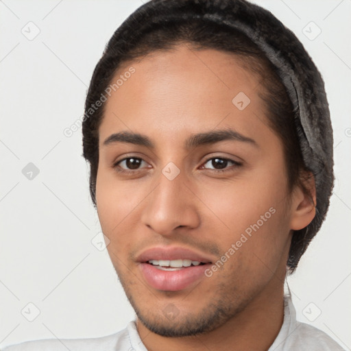 Joyful white young-adult male with short  black hair and brown eyes