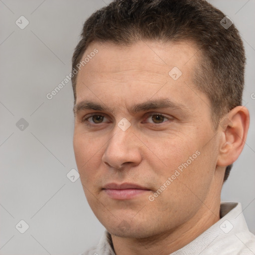 Joyful white adult male with short  brown hair and brown eyes