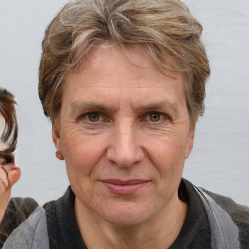 Joyful white adult male with medium  brown hair and brown eyes